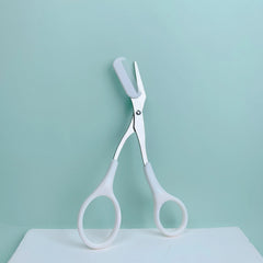 Pink eyebrow trimming scissors with built-in comb - stainless steel, precise grooming tool, creating perfect eyebrows